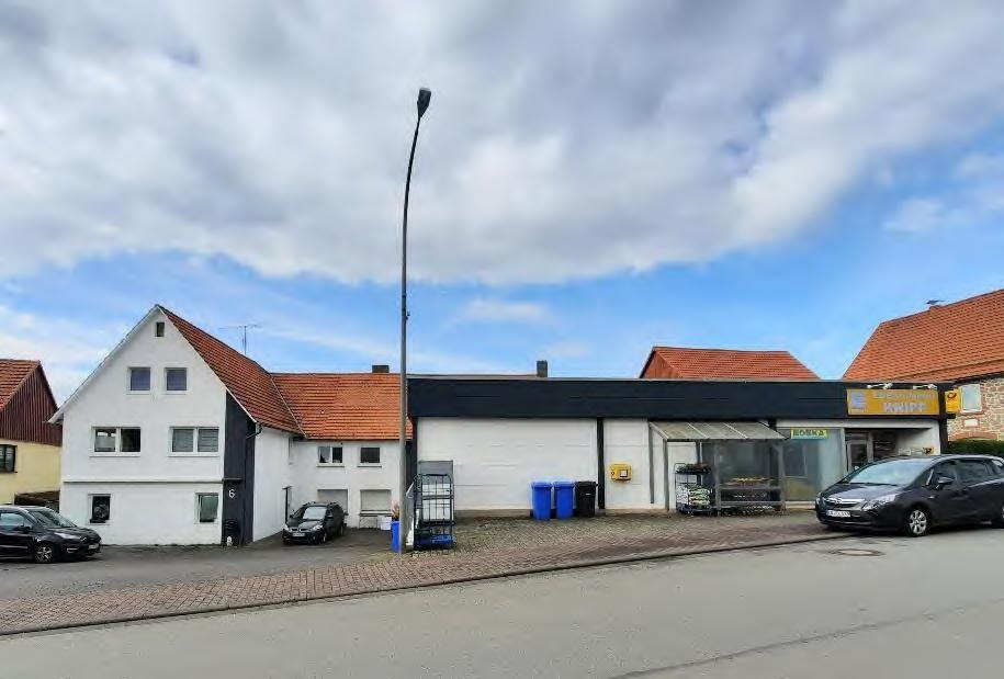 Mehrfamilienhaus, gewerblich genutztes Grundstück