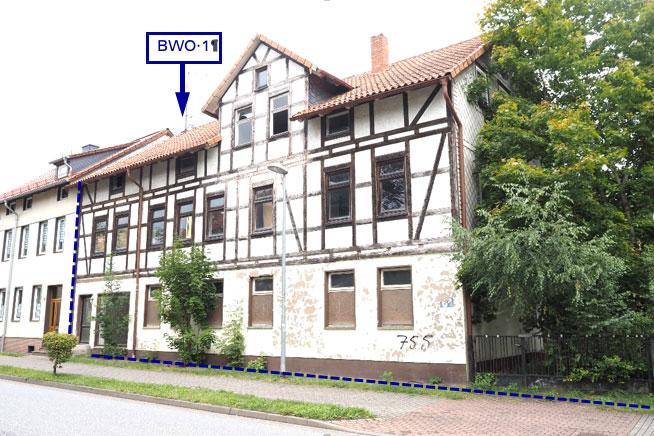 Wohn- und Geschäftshaus + unbebaute Grundstücke