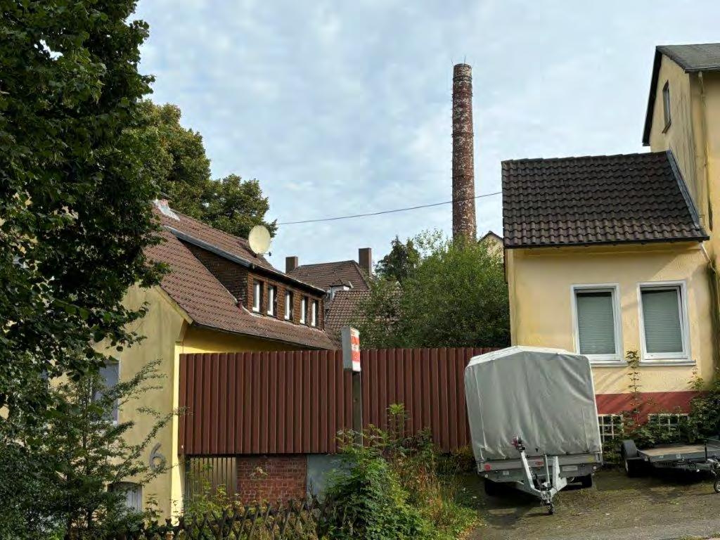 gewerblich genutztes Grundstück, Wohn-/Geschäftshaus, Kfz-Stellplatz (Tiefgarage)